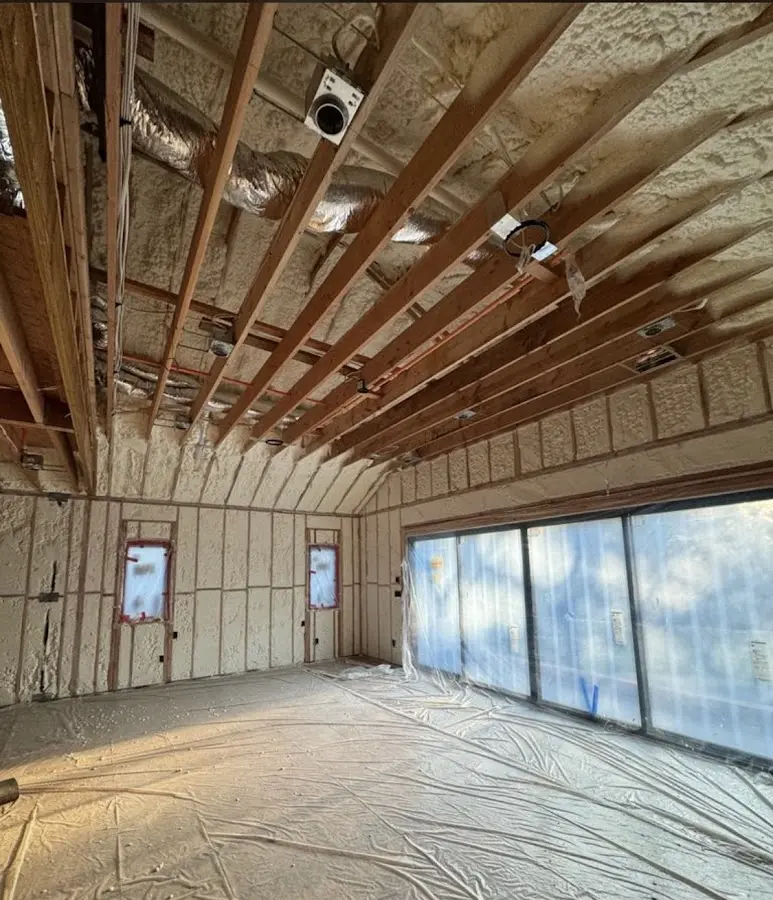 Interior walls and ceiling insulated with spray foam during new construction in East Huntingdon